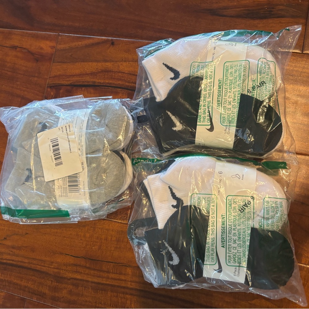 Brand new! Nike Cushioned Baby Socks - Black, white, and Gray. 18 pairs